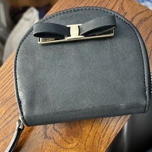 Adorable coin purse with decorative bow.  New. Never used.